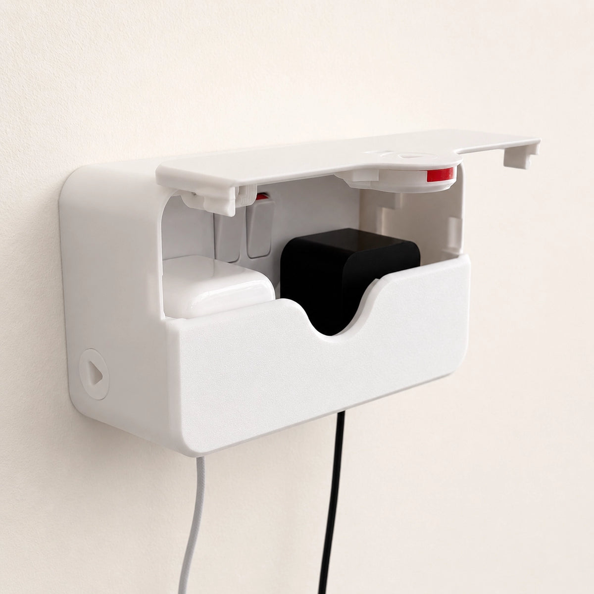 58mm Double PlugMinder fitted over a UK double socket with charging cables connected